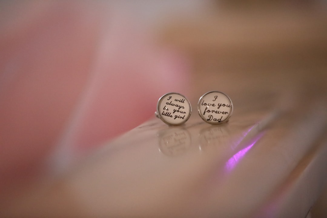 two-round-earrings-with-handwritten-text-tawosjisaju